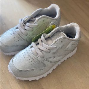 Brand new never worn tags on Reebok’s, small mark on back of one shoe, pictured